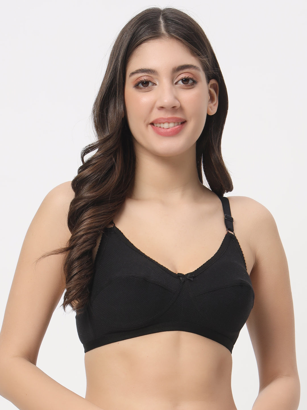 Woman wearing a black bra on a white background